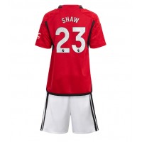 Fotbalové Dres Manchester United Luke Shaw #23 Dětské Domácí 2023-24 Krátký Rukáv (+ trenýrky)